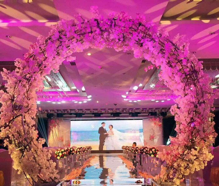 wedding arch with flowers and fabric10