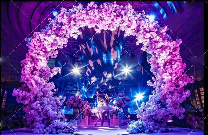 wedding arch with flowers and fabric